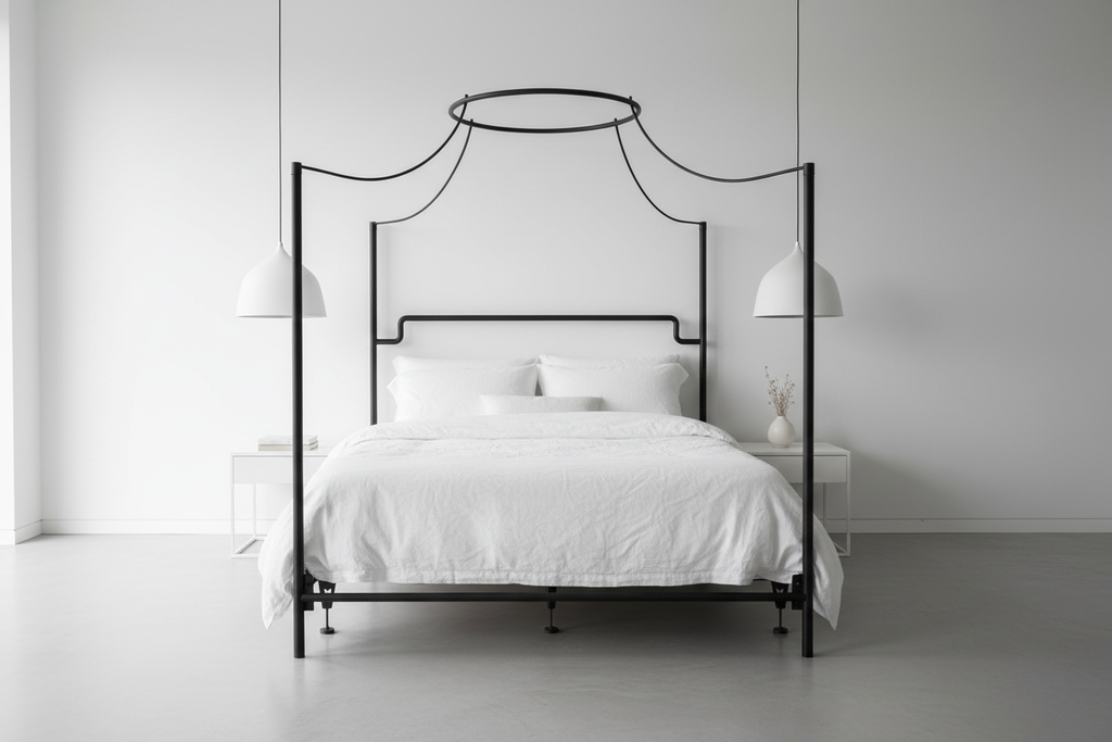 The Trinity Hand-Forged Halo Canopy Bed in a clean minimalist white bedroom with concrete floors and pendant lights